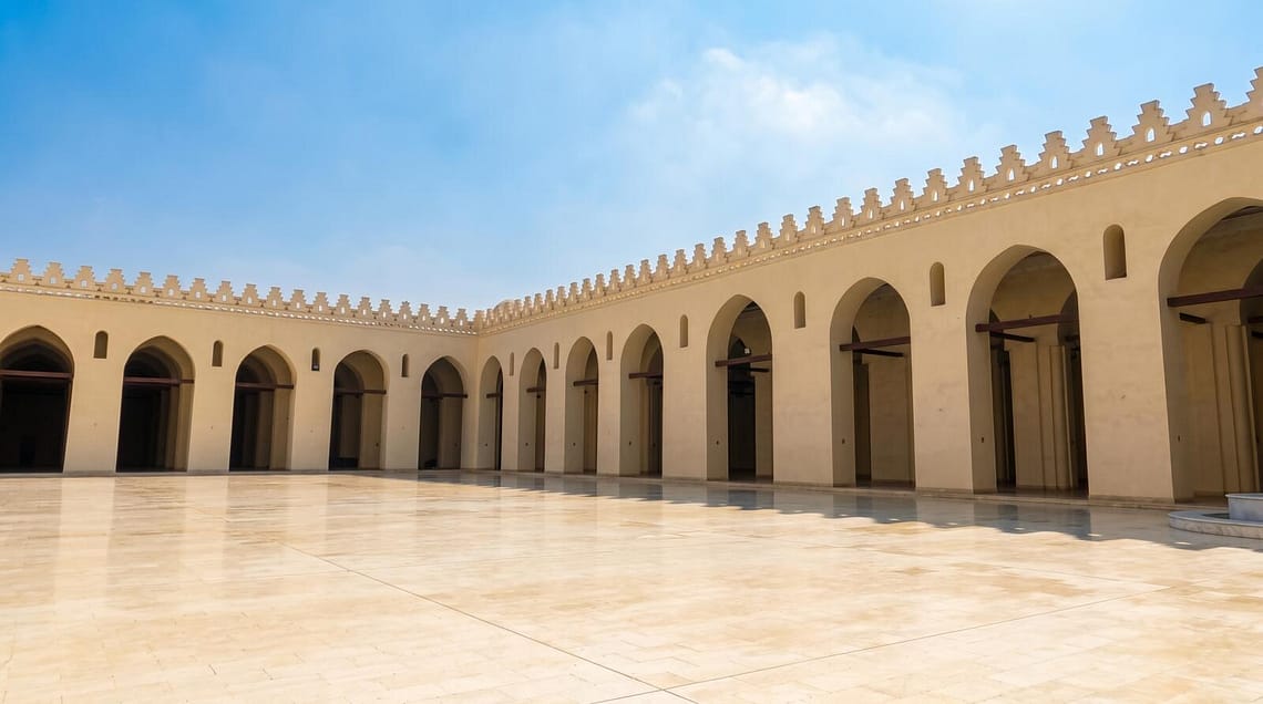 The beautiful stone facade of Al-Aqmar Mosque on Al-Muizz Street, representing the best Islamic Cairo attractions.
