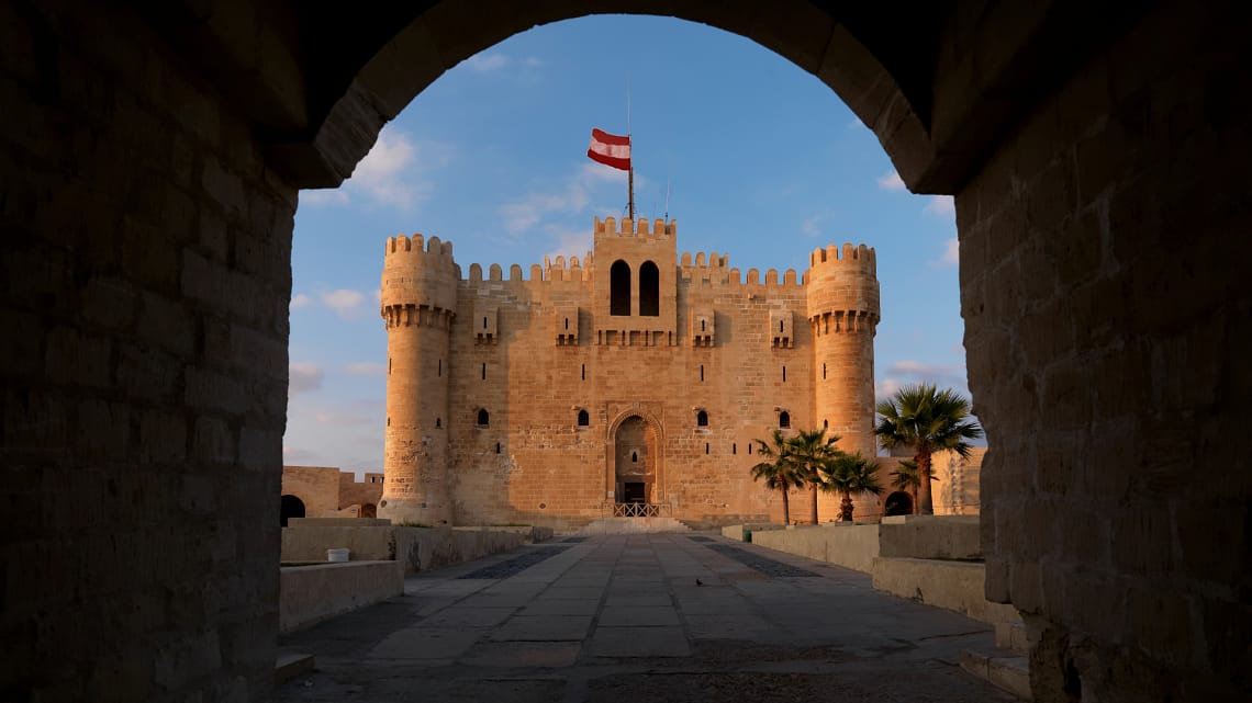 The historic Citadel of Qa15 Days Honeymoon Egypt - Citadel of Qaitbay in Alexandriaitbay, a 15th-century defensive fortress located on the Mediterranean Sea coast in Alexandria, Egypt.