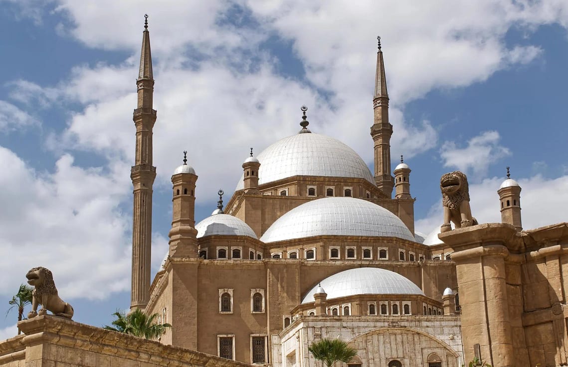 The majestic alabaster domes and minarets of Mohamed Ali Mosque at the Citadel of Cairo Egypt.