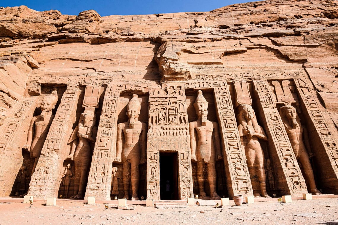 The colossal statues of R15 Days Honeymoon Egypt - Majestic Temples of Abu Simbelamses II at the entrance of the Great Temple of Abu Simbel in Aswan, Egypt