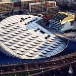 Modern circular architectural design of the Bibliotheca Alexandrina library roof viewed from above.