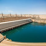 A wide-angle view of the Aswan High Dam and Lake Nasser, showcasing the modern engineering marvel that controls the Nile River in Egypt.