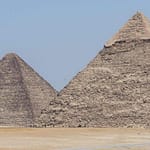 A panoramic view of the Great Pyramids of Giza under a clear blue sky, a key highlight of the private day tours from Hurghada offered by Top Class Egypt Travel.