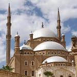 The majestic alabaster domes and minarets of Mohamed Ali Mosque at the Citadel of Cairo Egypt.