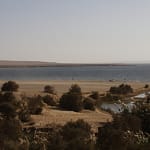 A panoramic view of the historic Qarun Lake surrounded by desert landscape in Fayoum Egypt.