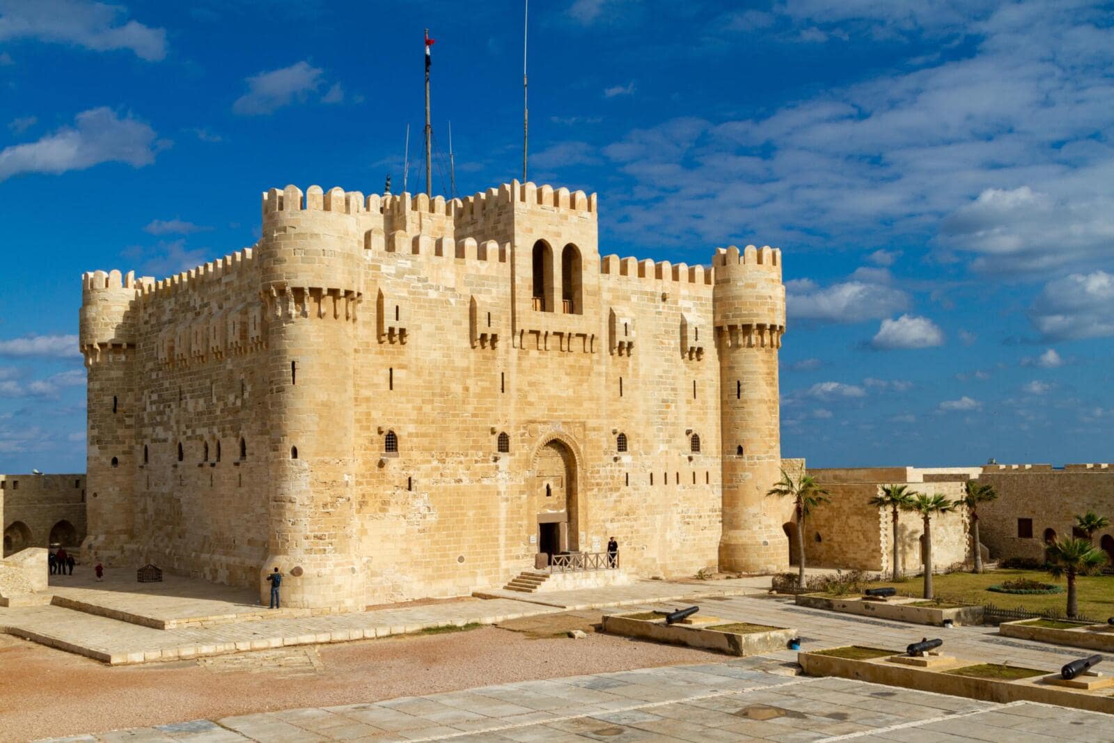 The historic stone walls and fortress of Qaitbay Citadel overlooking the Mediterranean Sea in Alexandria Egypt.