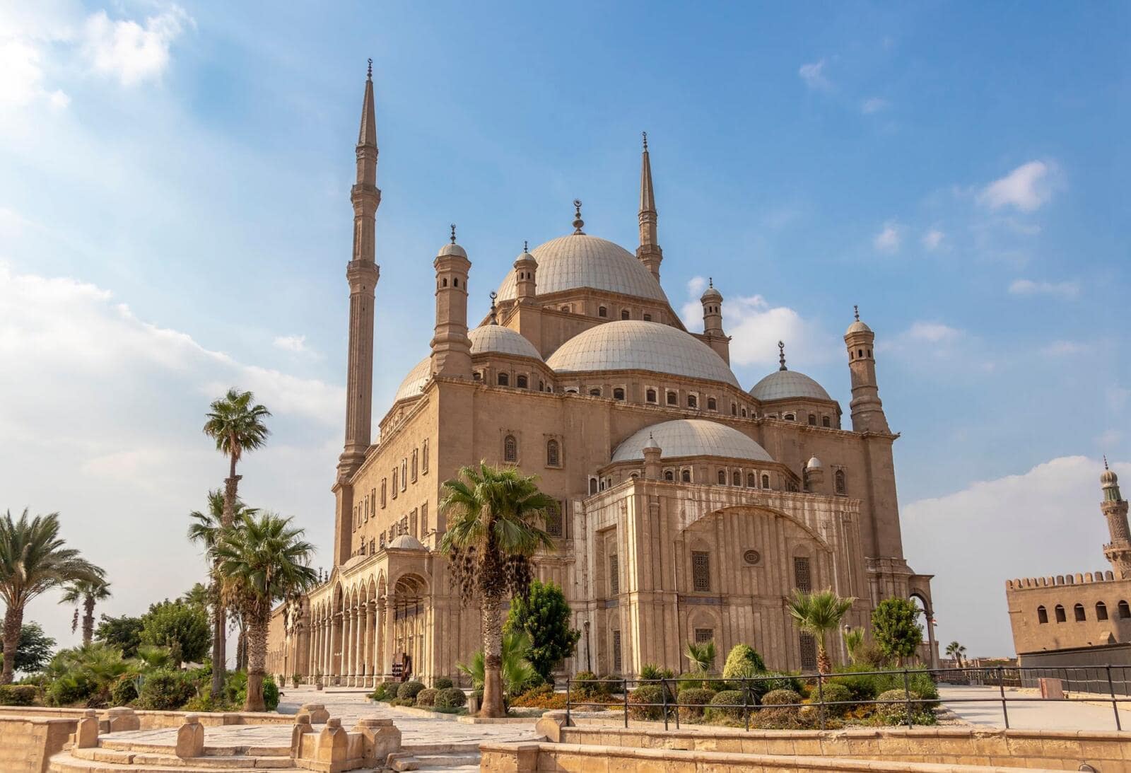 Exterior view of the Ottoman-style Mosque of Muhammad Ali with its iconic silver domes and twin minarets at the Saladin Citadel in Cairo.