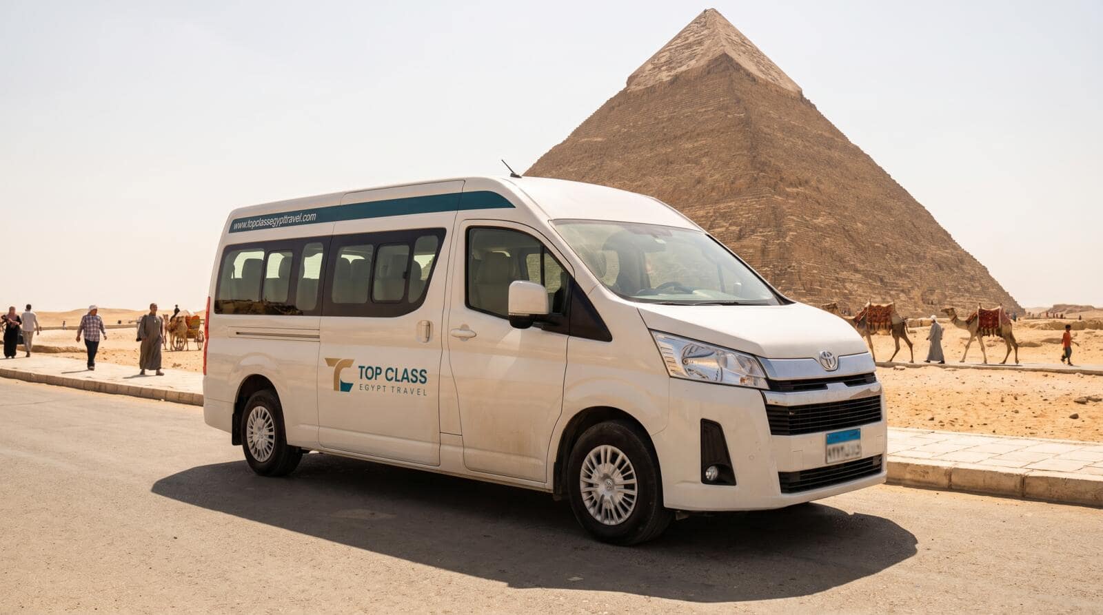 Top Class Egypt Travel private tourist van at the Giza Plateau Pyramids